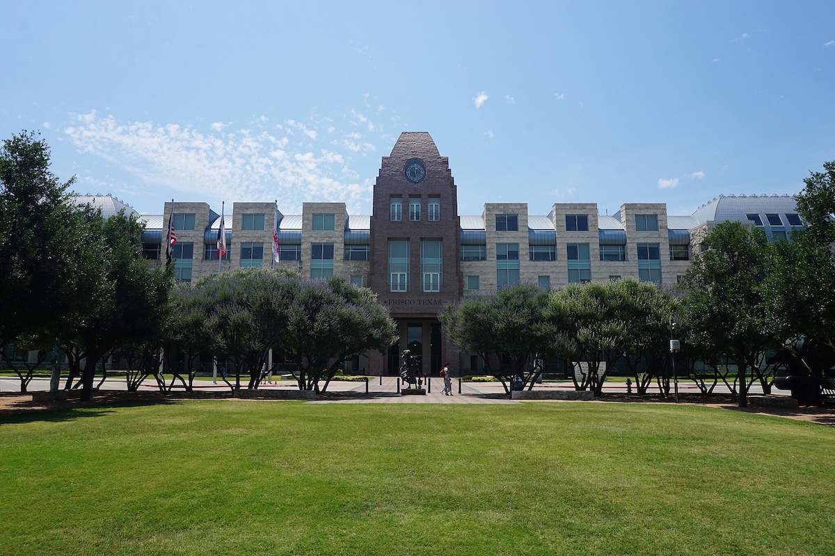 Frisco Texas square building with blue sky in the background